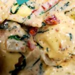 Spinach & Ricotta Ravioli with alfredo, sundried tomatoes & spinach